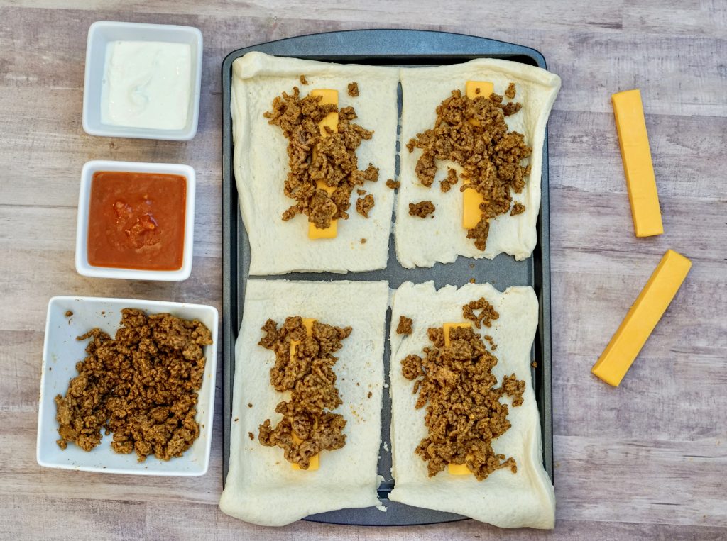 Taco Rollup Recipe - This incredible Taco Rollup Recipe will make you drool. It smells amazing as it bakes and it's easily customizable. Perfect for busy weeknights too! #taco #easy #dinner #rollups #breagettingfit