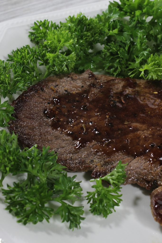 Delicious Sirloin Tip steak smothered in a wine sauce is out of this world. Every bite is juicy, full of flavor and leaves a lasting impression. #steak #dinner #easy #redwinesauce #sauce #delicious #breagettingfit
